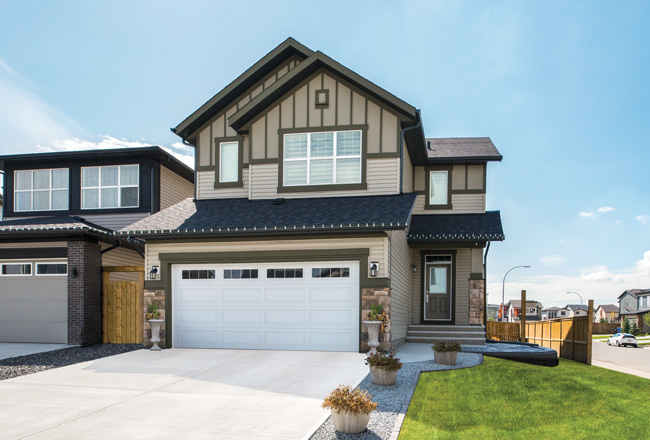 traditional long panel garage door with windows